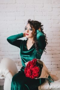 beautiful-woman-in-green-velvet-dress-sitting-on-w-2024-12-05-11-30-13-utc-1.jpg